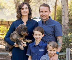 Rochelle with her husband, sons, and family pet.