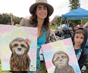 Rochelle and her son show off their artwork!