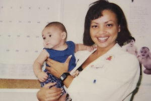 Dr. Chanelle Calhoun with pediatrics patient in 1994