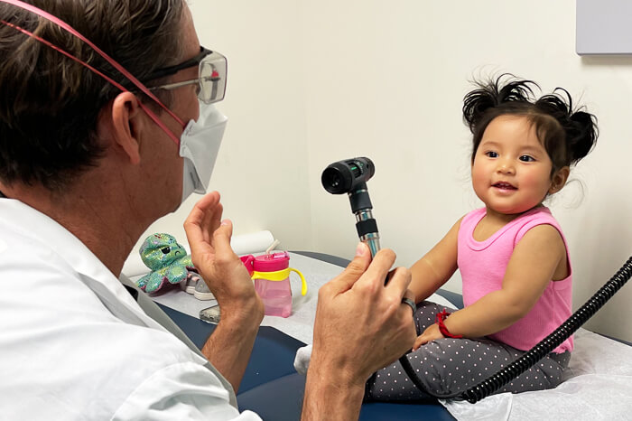 Dr. Curley pediatrician check up with cute baby girl