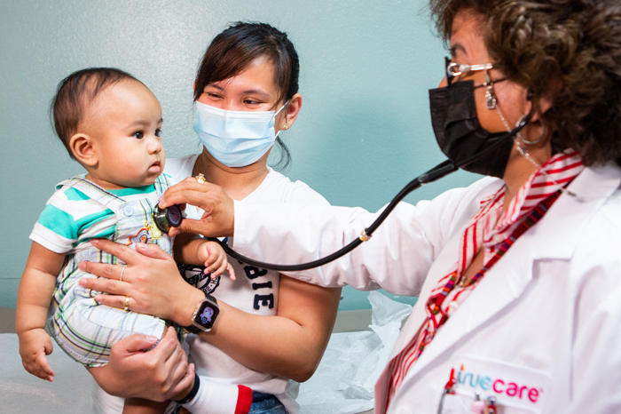 Dr. Quintero pediatrician check up with baby boy and mom