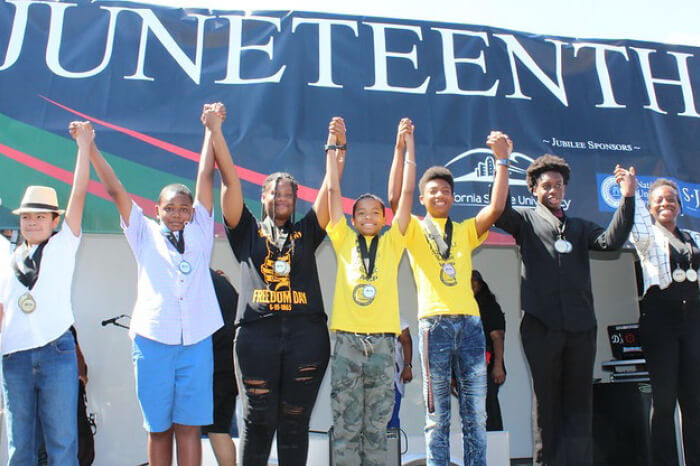 Juneteenth 2023 event african american kids holding hands