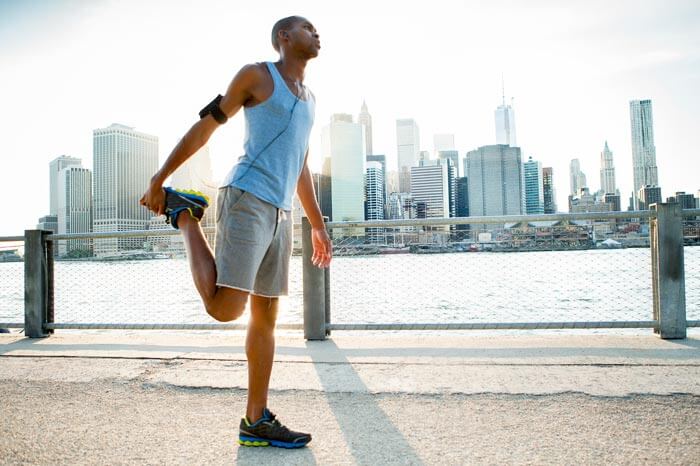 Man stretching in New York getting ready for a run