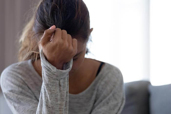 truecare-featured-image-mental-health-blog-700×466 Depressed upset young woman feeling hurt sad stressed troubled with unwanted pregnancy, regret mistake abortion, having headache or drug addiction, suffer from grief dramatic bad problem, mental health issue, anxiety