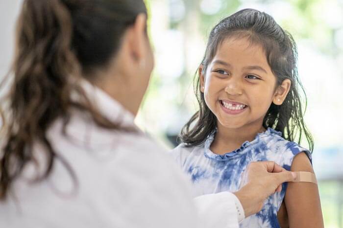 truecare-little-girl-at-drs-office-immunization-700×466-1