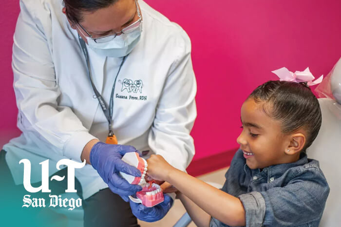 truecare-news-ut-mission-mesa-pediatric-dental-featured-image-blog-700×466 Union Tribune TrueCare Mission Mesa Pediatric Dental patient with dentist