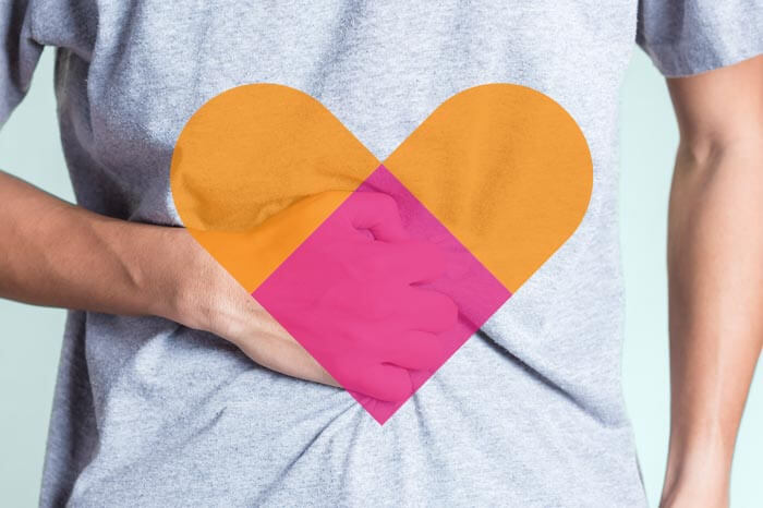 man clenching his stomach