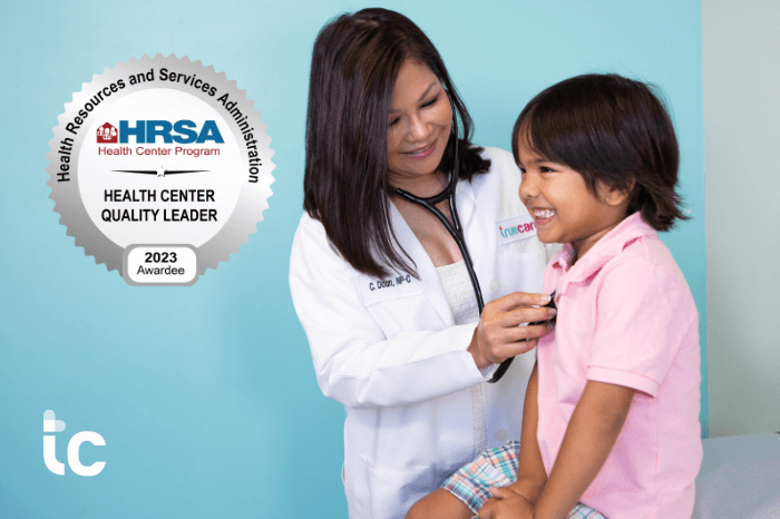 TrueCare doctor exams a young pediatric patient.